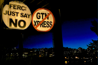 protest signs that read "FERC: Just say NO" and "NO GTN XPRESS"