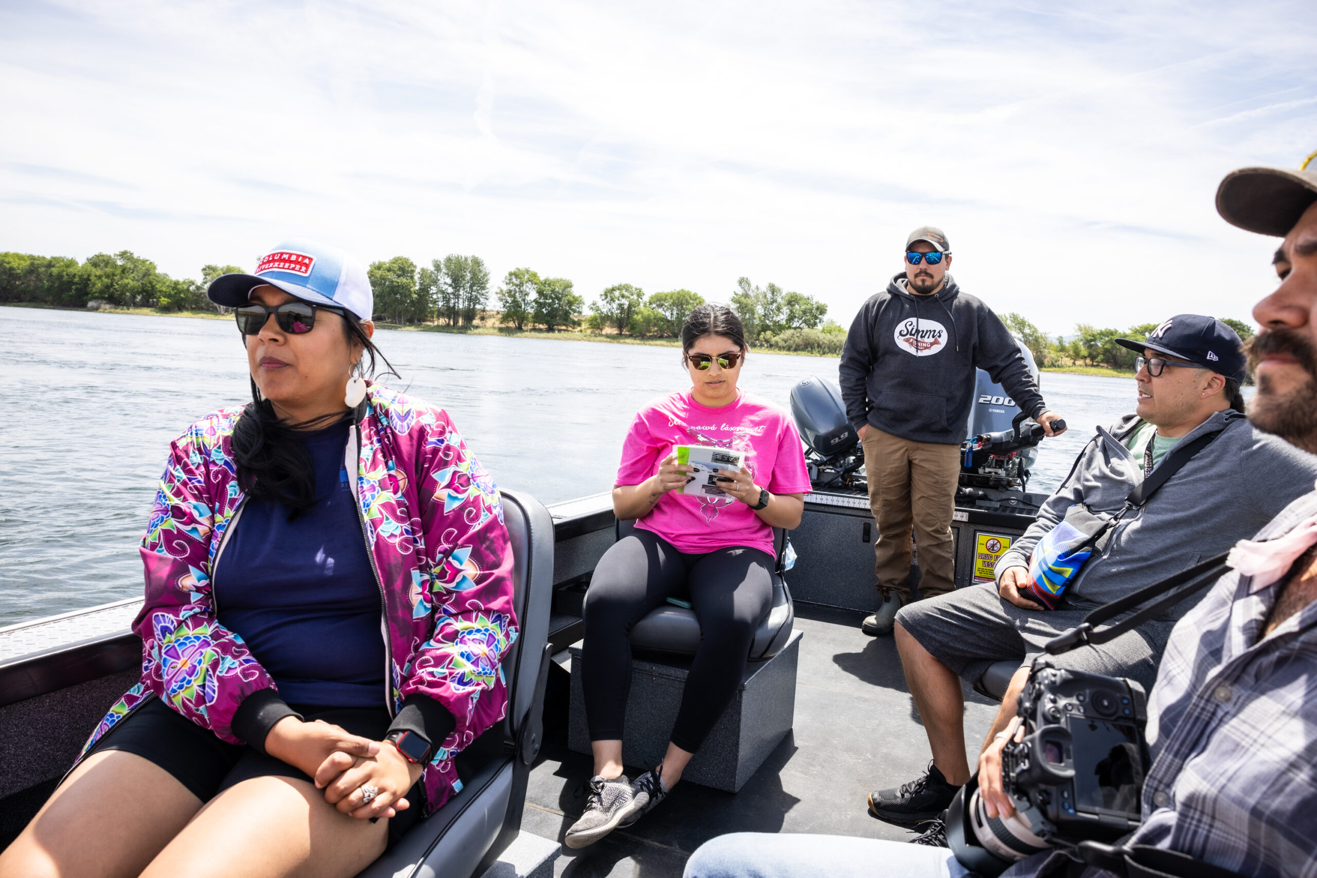 Columbia Riverkeeper Board President and enrolled Yakama member, Emily Washines, on a boat at Hanford Reach at the 2024 Hanford Journey. Photo by Kelly Turso.